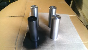 Figure 2. Each machined 3 lb weight has a sanded finish and then wiped clean with acetone and then painted flat black.